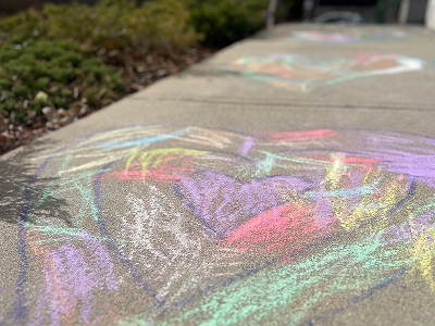 Heart chalk art on school sidewalk