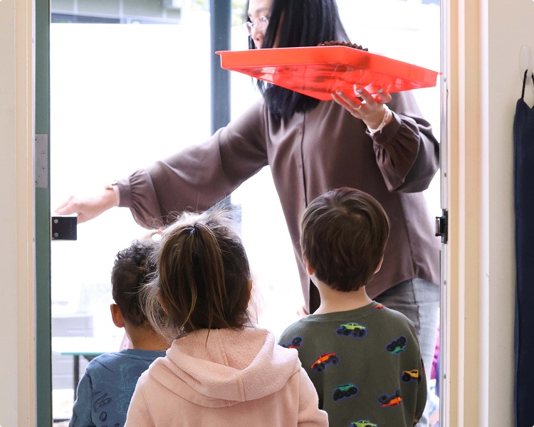 CHDS-PS2-main Preschool teacher leading students outside