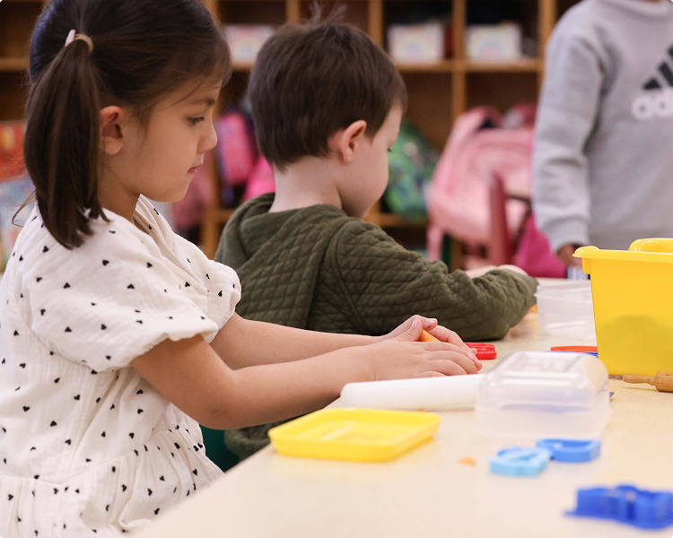 CHDS-Philosophy-main Preschool student playing using learning tools