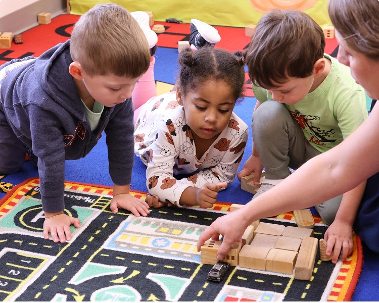 CHDS-PreK-main Preschool students learning about blocks with a teacher