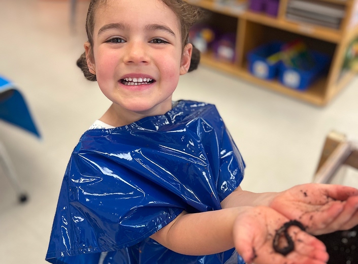 PreKK student learning about earth worms