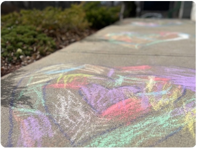 Heart chalk art on school sidewalk